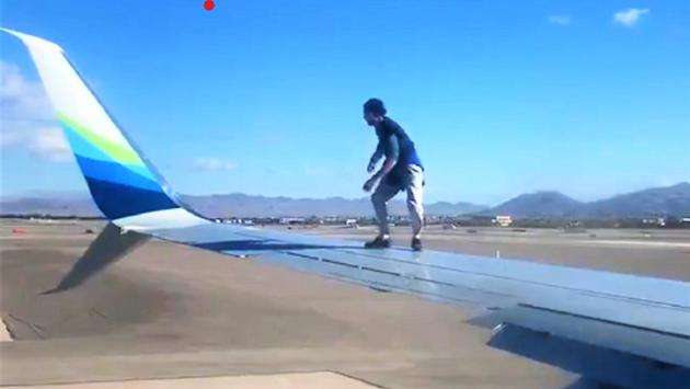 WATCH: Man Disrupts Plane, Climbs Onto Wing Before Takeoff